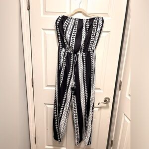 Black and white strapless CUPSHE jumpsuit with side slits on leg